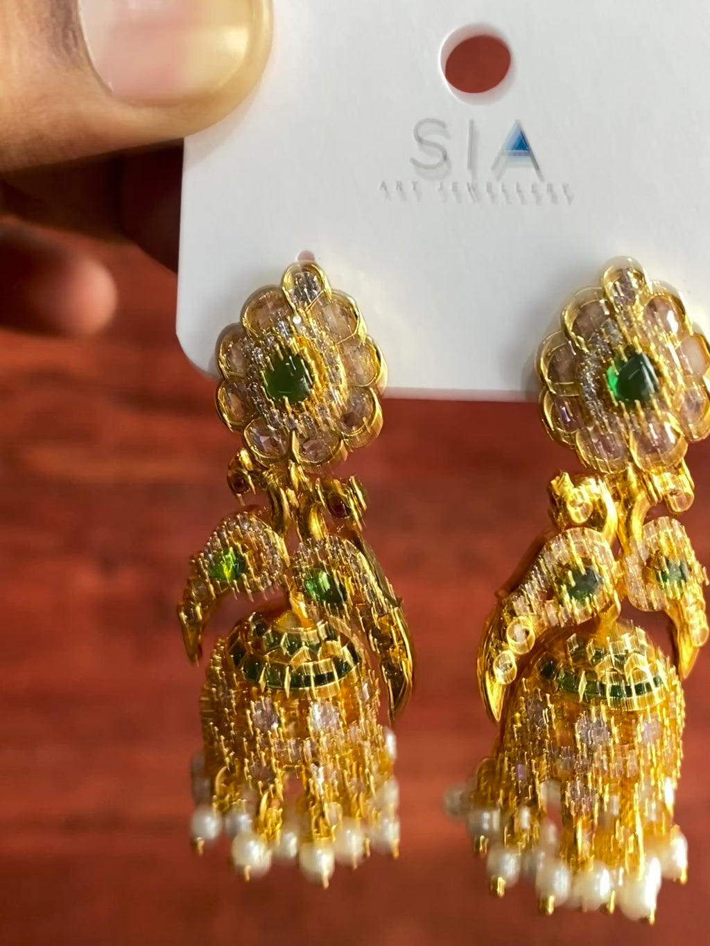 Royal Peacock Pearl Jhumka Earrings with American Diamonds & Green Stones | Gold-Plated Traditional Bridal Earrings for Women
